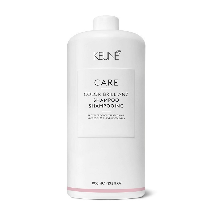 a white bottle with pink label