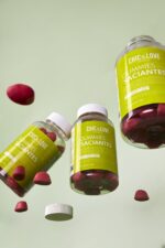 a group of bottles with red candies in them